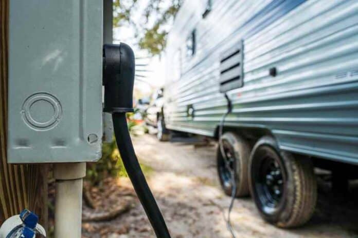 RV Power Cord Connected to Campsite Pedestal